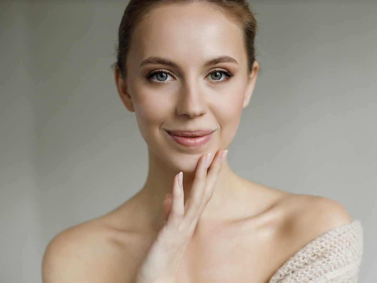 Portrait of a woman with clear, even skin and a natural complexion